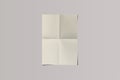 Empty blank craft folded A4 paper Mock isolated on a grey background. Folded newspaper insert. Royalty Free Stock Photo