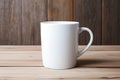 Empty blank mock up of white ceramic coffee mug on wooden table Royalty Free Stock Photo