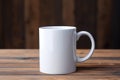 Empty blank mock up of white ceramic coffee mug on wooden table Royalty Free Stock Photo