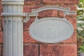 Empty blank steel signboard for any title or name with brick wall background