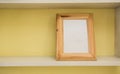 Empty blank vintage picture frame with yellow wall Royalty Free Stock Photo