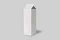 Empty blank white cardboard milk packaging box isolated on a grey background. Royalty Free Stock Photo