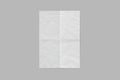 Empty blank white folded crumpled paper Mock up isolated on a grey background. Royalty Free Stock Photo