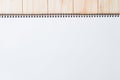 Empty blank white front page cover of spiral bound notepad on the wooden background Royalty Free Stock Photo