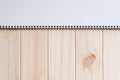 Empty blank white front page cover of spiral bound notepad on the wooden background Royalty Free Stock Photo