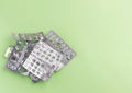 Empty blister packs from tablets on a green background. The packaging of the tablets. flat lay. Copyspase Royalty Free Stock Photo