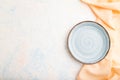 Empty blue ceramic plate on white concrete background. Top view, copy space Royalty Free Stock Photo