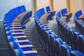 Empty blue chairs at cinema or theater or a conference room Royalty Free Stock Photo
