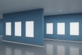 Empty blue gallery interior with blank white mock up frames on wall and reflections on floor. Art, no people, museum and Royalty Free Stock Photo