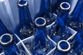 Empty blue glass beer bottles in the box Royalty Free Stock Photo