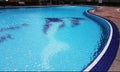 Empty Blue Mosaic swimming pool with sparkling ripples