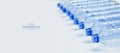 Empty blue plastic bottles stacked in a line. Waste recycle concept. Manufacturing process.  Web article template. Long header. Royalty Free Stock Photo
