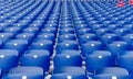 Empty blue plastic chairs in a row at the football stadium