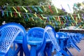 empty blue plastic chairs and tables outside, preparing for the holiday, no people Royalty Free Stock Photo