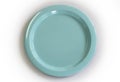 Empty blue plate on white background.