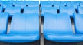 Empty blue seats or chair rows in stadium Royalty Free Stock Photo