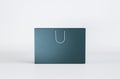 Empty blue shopping bag on light background with mock up place. Purchase and commerce concept. Royalty Free Stock Photo