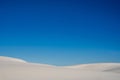 Empty Blue Sky Over Smooth White Sand Dunes Royalty Free Stock Photo