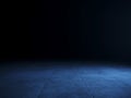 Empty blue spot lit dark concrete floor Royalty Free Stock Photo