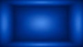 Empty blue studio background with soft spotlight effect and gradient image photo Royalty Free Stock Photo