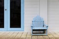 Blue wood sun loungers in front of the rooms at the seaside resort