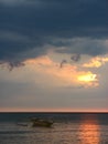 Empty Boat on a Beach Sunset