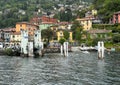 Empty boat dock at Varenna on Lake Como photographed from an approaching ferry of the Navigazione Laghi Royalty Free Stock Photo