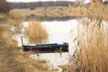 Empty boat at rushy shore Royalty Free Stock Photo