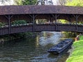 Boat under wooden bridge idyllic scenery at spring Royalty Free Stock Photo