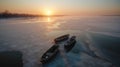 Empty boats on iced lake. On drone view.