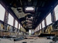 Empty bogey of the retired train with rusty debris and garbage inside Royalty Free Stock Photo