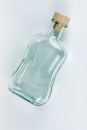 Empty bottle with cork on a light background. Royalty Free Stock Photo