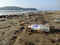 Empty bottle and garbage in the beach of Goa Royalty Free Stock Photo