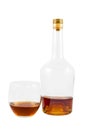 Almost empty bottle and glass of whiskey Royalty Free Stock Photo