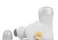 Empty bottles of deodorants and orchid flower isolated on white. Royalty Free Stock Photo