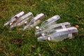 Empty bottles on the grass Royalty Free Stock Photo