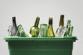 Empty bottles in green container