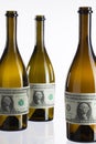 Empty bottles of wine from the label of dollar bill Royalty Free Stock Photo