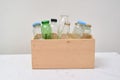 Empty bottles in woodden container Royalty Free Stock Photo