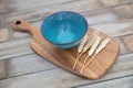 An empty bowl and a few ears of wheat Royalty Free Stock Photo