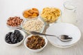 Empty bowl, spoon, milk, ingredients for preparation muesli on t Royalty Free Stock Photo