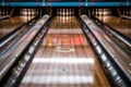 Empty bowling lanes with pins ready for action Royalty Free Stock Photo