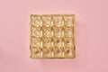 Empty box of chocolates on pink pastel background - birthday or party concept