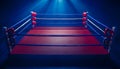 Empty boxing ring from top view. Red canvas mat, blue and white ropes, corner posts with red gloves. Dark blue Royalty Free Stock Photo