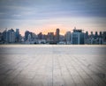 Empty brick floor with cityscape and skyline