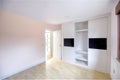 Empty bright bedroom with built-in wardrobes. Interior modern bedroom