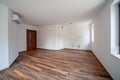 Empty bright living room. Beautiful apartment interior. Wooden floor Royalty Free Stock Photo