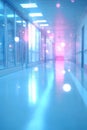 Empty brightly lit hospital hallway with blurred lights, long empty corridor in a modern clinic Royalty Free Stock Photo