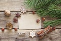 Empty brown card with pine branches, nuts, cinnamon sticks and s Royalty Free Stock Photo