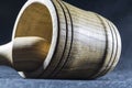 Empty brown mortar with a pestle wooden. A drinking bowl for crushing of spices. Black background. Kitchen utensils. Ware.